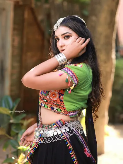 A stylish pose from the Navratri shoot, highlighting the colorful embroidery and mirror work of the chaniya choli.