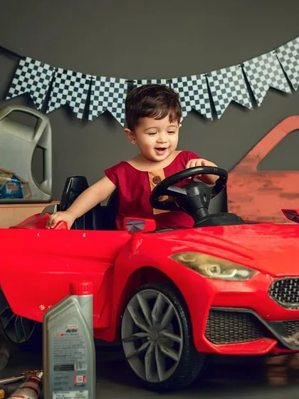 In the driver's seat and ready to celebrate. I love bringing creative ideas like this car-themed photoshoot to life for a memorable milestone.