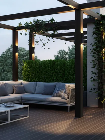 Our architectural services extend to creating serene outdoor living areas, like this rooftop terrace. We designed this space with a modern pergola, comfortable lounge seating, and integrated lighting, transforming an open roof into a private retreat for relaxation and entertainment.