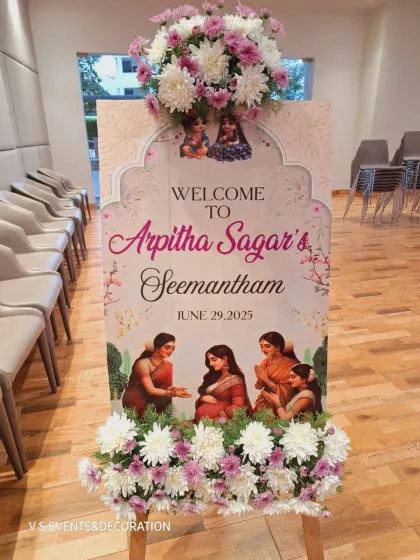 I also create personalized welcome signs for your events. This one for a Seemantham features custom artwork and is adorned with fresh flowers.