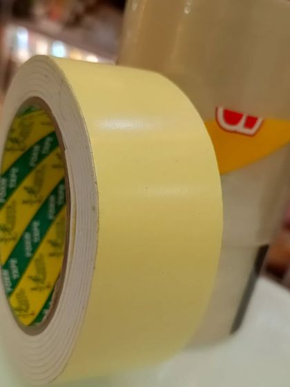 A close-up of a roll of double-sided tape, showing the quality and thickness. This is a must-have for any serious decorator.
