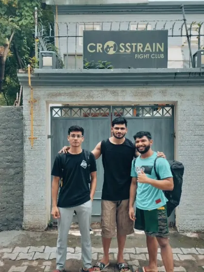 Teammates outside the Crosstrain Fight Club gate. The bond forged inside the gym extends outside as well.