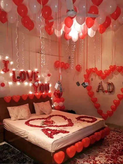 We love adding personal touches to your celebration. This romantic room makeover features custom initials inside a heart made of balloons, along with an "I Love You" message, hundreds of balloons, and rose petals for a deeply personal surprise.