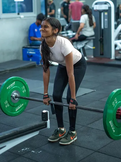 A young member showing incredible strength and form during a deadlift. We believe in teaching proper technique from day one to build a foundation for lifelong fitness.