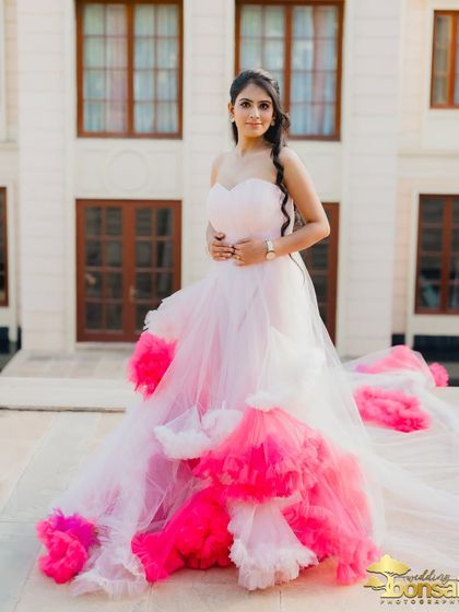 A portrait of the bride on the terrace, with her colorful gown spread out, creating a beautiful and vibrant image.
