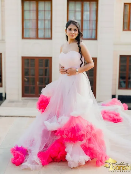 A portrait of the bride on the terrace, with her colorful gown spread out, creating a beautiful and vibrant image.
