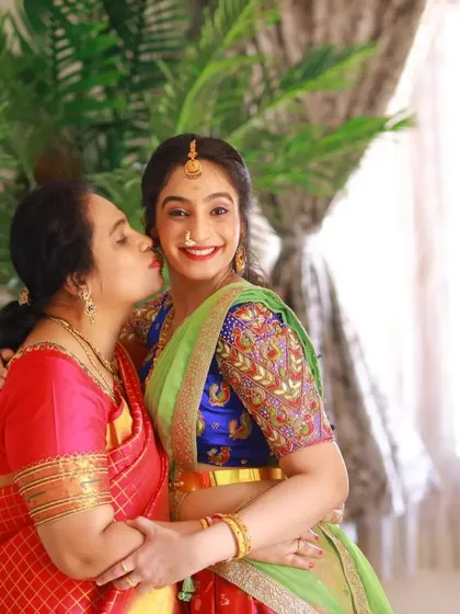 A heartwarming mother-daughter moment. I designed this custom lehenga with a beautifully embroidered blue blouse for the daughter to wear at a family celebration.