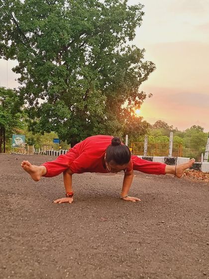 Yoga and sunset. Holding a firefly pose as the sun goes down. Arm balances connect you deeply to your own power and the beauty of the present moment.