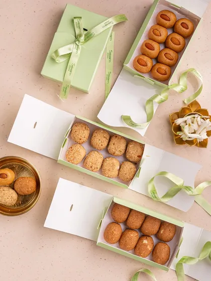 My laddoos feel like a warm hug. Here are three different varieties of my traditional laddoos, unboxed and ready to be shared, each made just the way nani used to.