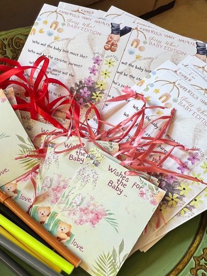 A collection of my custom baby shower printables, including game cards and wish tags.