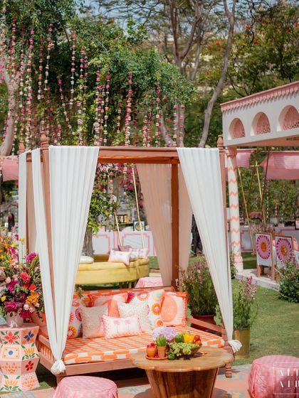 A canopied daybed at the 'Gulbahar' Holi celebration, surrounded by lush florals and quirky printed textiles. It was the perfect spot to relax and enjoy the festivities.