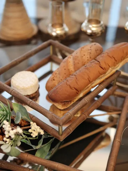 Freshly baked baguettes and cheese served on our two-tiered mirror tray with a wooden bamboo-style frame. It’s an essential piece for creating an elegant grazing table.
