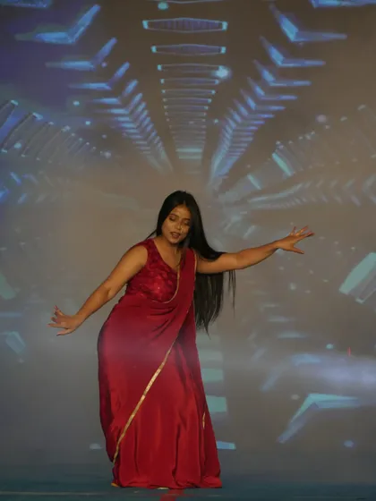 A student performing a classical dance piece, showcasing grace and skill. Our stage provides a platform for every form of artistic expression.