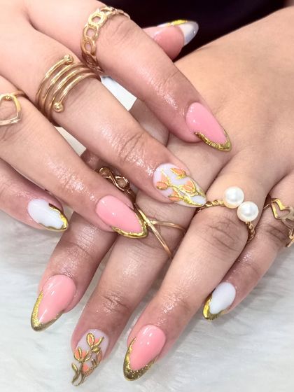 This angle, with stacked rings, shows how beautifully these elegant floral nails accessorize and complete a look.