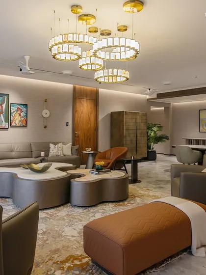 A full view of a residence envisioned as a sanctuary shaped by light, stillness, and balance. The living and dining areas open up for both gathering and retreat, with curved sofas, soft textures, and heirloom artworks lending intimacy and personality.