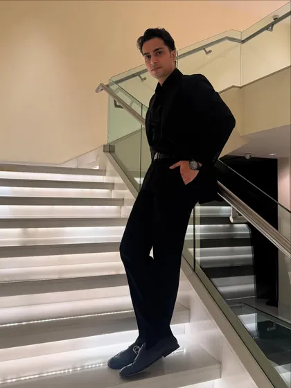 Another angle of the all-black suit. From the boardroom to the ballroom, I'm always dressed for the occasion.
