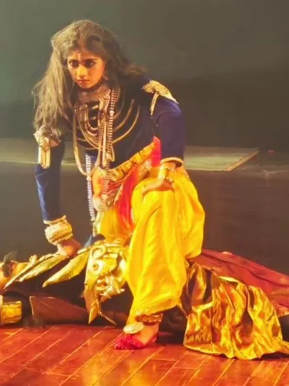 A powerful depiction of Krishna's victory over the tyrannical king Kamsa. The intense expressions and dramatic staging make this a climactic and memorable moment in the production.