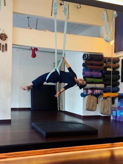 This pose demonstrates how the hammock can be used as a tool to hold challenging positions, building endurance and strength through sustained effort.