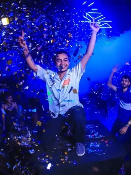 Jumping with the beat during a massive confetti drop. This is the kind of explosive energy I bring.