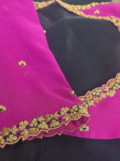 A classic georgette saree blouse with hand embroidery, designed for an evergreen Mysore Silk Saree. The scalloped, embroidered edges add a delicate finish.