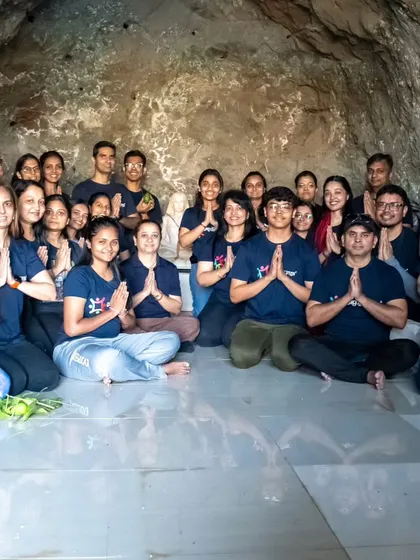 A group of seekers meditating together inside a natural cave. These unique sessions allow for deep introspection, free from the distractions of the outside world, connecting us to ancient yogic traditions.