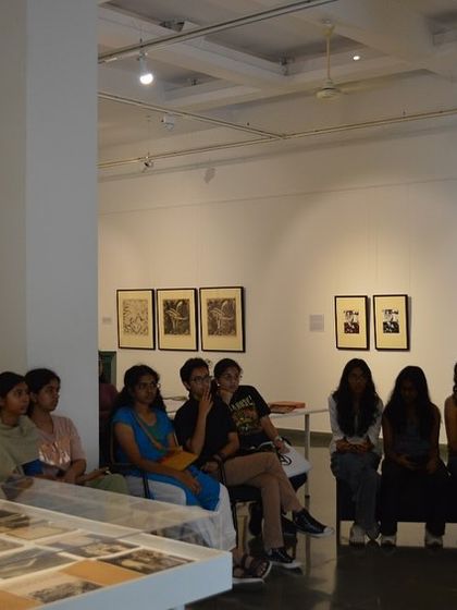 Students from Head Start Educational Academy watching a film about the artist during their visit to 'Hand Prints'.