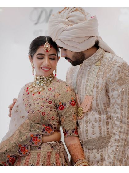 A tender and quiet moment between the couple. The soft lighting and their gentle embrace create a feeling of warmth and deep affection.