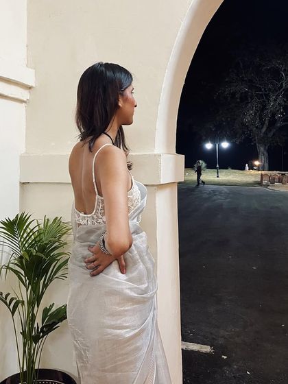 Another angle of the white and silver sari look. The backless blouse adds a modern and sensual touch to the traditional drape.