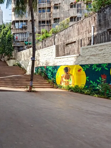 A view of the revitalized St. Stephen's Steps, with its wide, accessible ramp and vibrant murals. The design integrates art and universal accessibility, ensuring the space is welcoming to people with prams, wheelchairs, and bicycles.