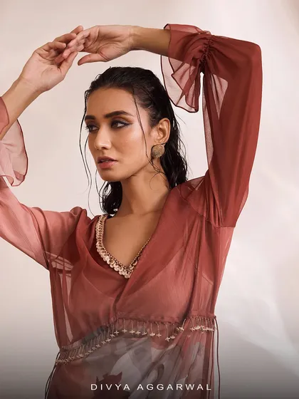 A close-up of the Aurelia Kaftan Set, highlighting the delicate embellishments on the V-neckline and the soft, ruffled sleeves.