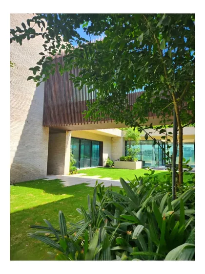 The courtyard of our Dubai Hills villa. The design sucks the green of the golfing fairway into the home, blurring the line between the garden and the interior.