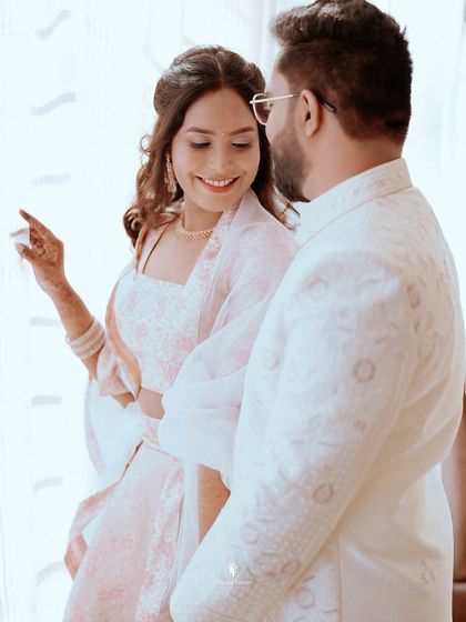 A sweet, candid interaction between the couple during their engagement session. It's these unposed, natural moments that often become the most cherished memories.