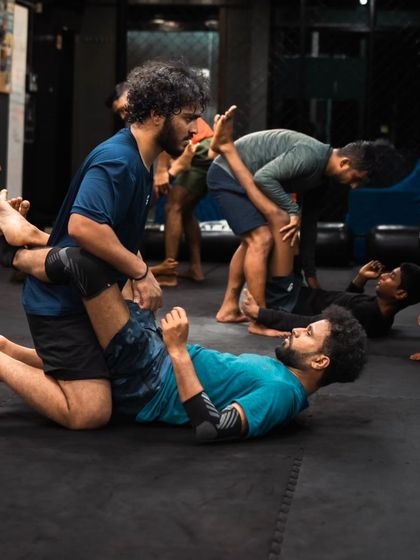 Students pair up to practice guard passing drills, a key part of our Jiu-Jitsu curriculum.