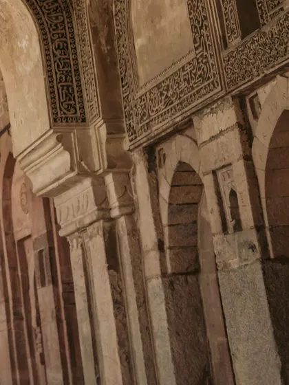 Another perspective of the intricate calligraphy and stonework of a heritage site, showcasing the beauty of the locations we choose for our shoots.