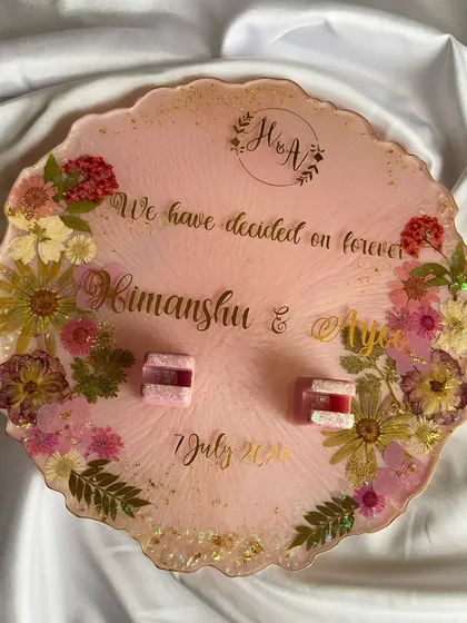 This 10-inch decorative platter was designed to be the perfect display for their engagement rings. I used real preserved flowers and a custom quote to create an elegant and romantic setting.