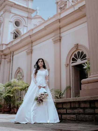 A classic portrait of a Christian bride, holding her bouquet just moments before walking down the aisle. I aim to capture the serene beauty and quiet excitement that fills the air.