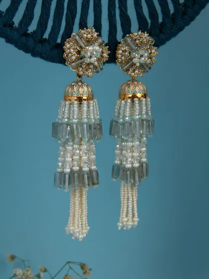 A throwback to one of our record-breaking bestsellers, these jhumka-style danglers with blue beads and pearls.