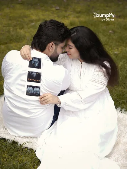 Another beautiful pose from the same session, with the couple sharing an intimate moment while displaying the sonogram. These are the memories you'll cherish forever.