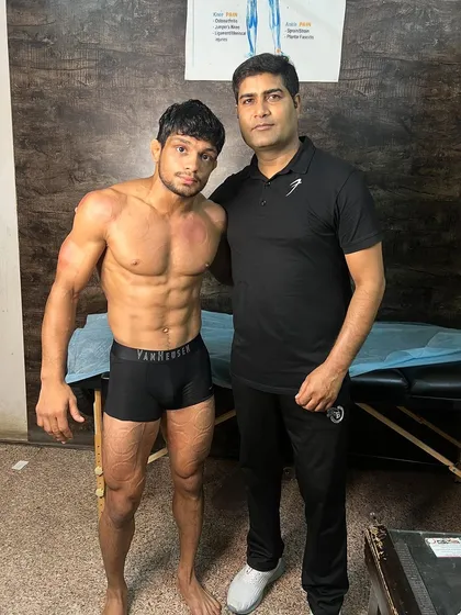 With national wrestling player Amit Kumar.