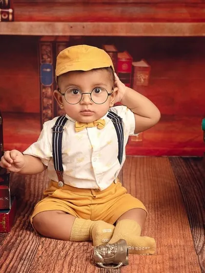For the fans of magic, my 'Baby Potter' theme is a whimsical dream. With tiny glasses and a library of books, we can create a truly enchanting scene for your little wizard.