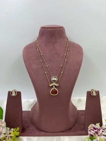 My 'Myra' crystal bloom necklace, a delicate two-layer piece with a crystal pendant.