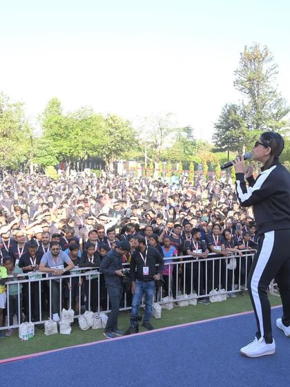 Engaging with the huge crowd of runners at the Honda marathon. My job is to get them pumped up and ready to go.