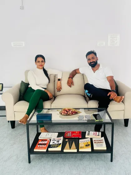 A post-session photo with a client in our lounge area. It's a space for us to connect beyond the workout.