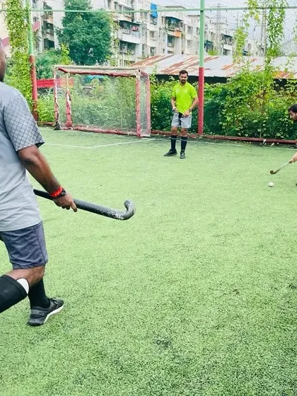 A player prepares to hit the ball during a Sunday practice. These sessions are a great way to hone skills in a relaxed yet competitive setting.