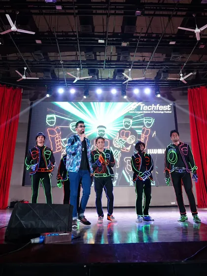 Sharing the stage with the talented performers of the Illuminati dance crew at Techfest. A host's job is also to make the artists shine.