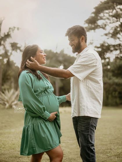 A tender moment between the parents to be. His gentle touch as he frames her face shows so much love and admiration in this beautiful outdoor portrait.