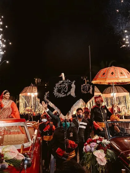 A grand joint entry for the bride and groom in matching vintage cars, complete with fireworks. This is how I help couples make a statement and create a shared memory of pure joy and celebration.