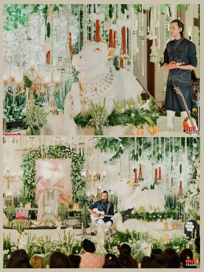 A serene and spiritual Satsang event, with decor featuring a beautiful Nandi, swans, and an abundance of white flowers.
