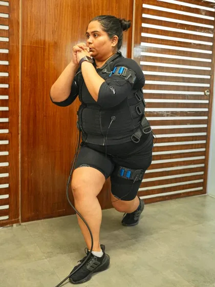 Comedian Sumukhi Suresh proves that fitness can be fierce and fun. Here she is powering through a lunge in her EMS suit.