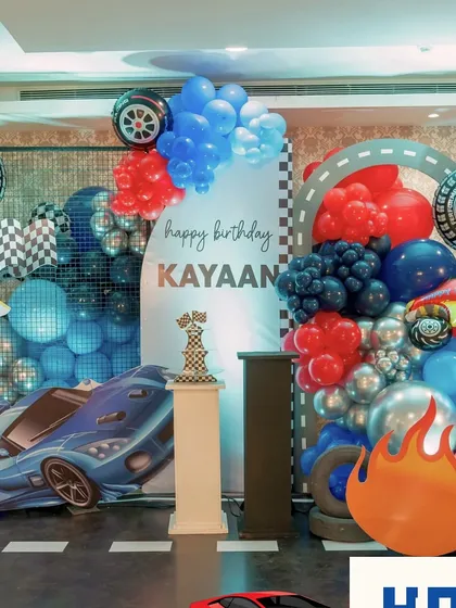 A high-energy racecar-themed birthday setup. We used balloons, checkered flags, and car cutouts to create a dynamic and exciting atmosphere for the birthday boy.